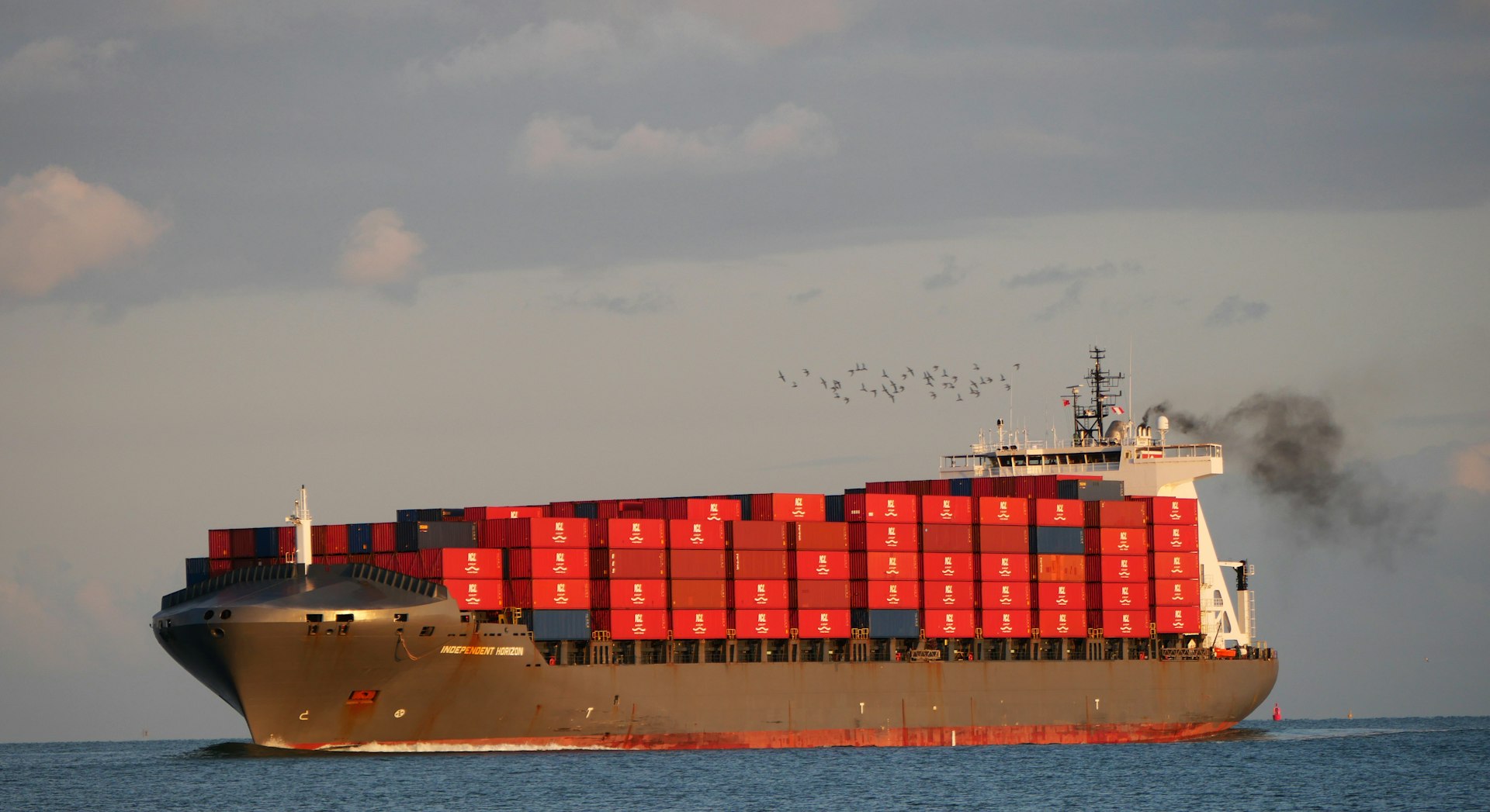 A large cargo ship in the middle of the ocean
